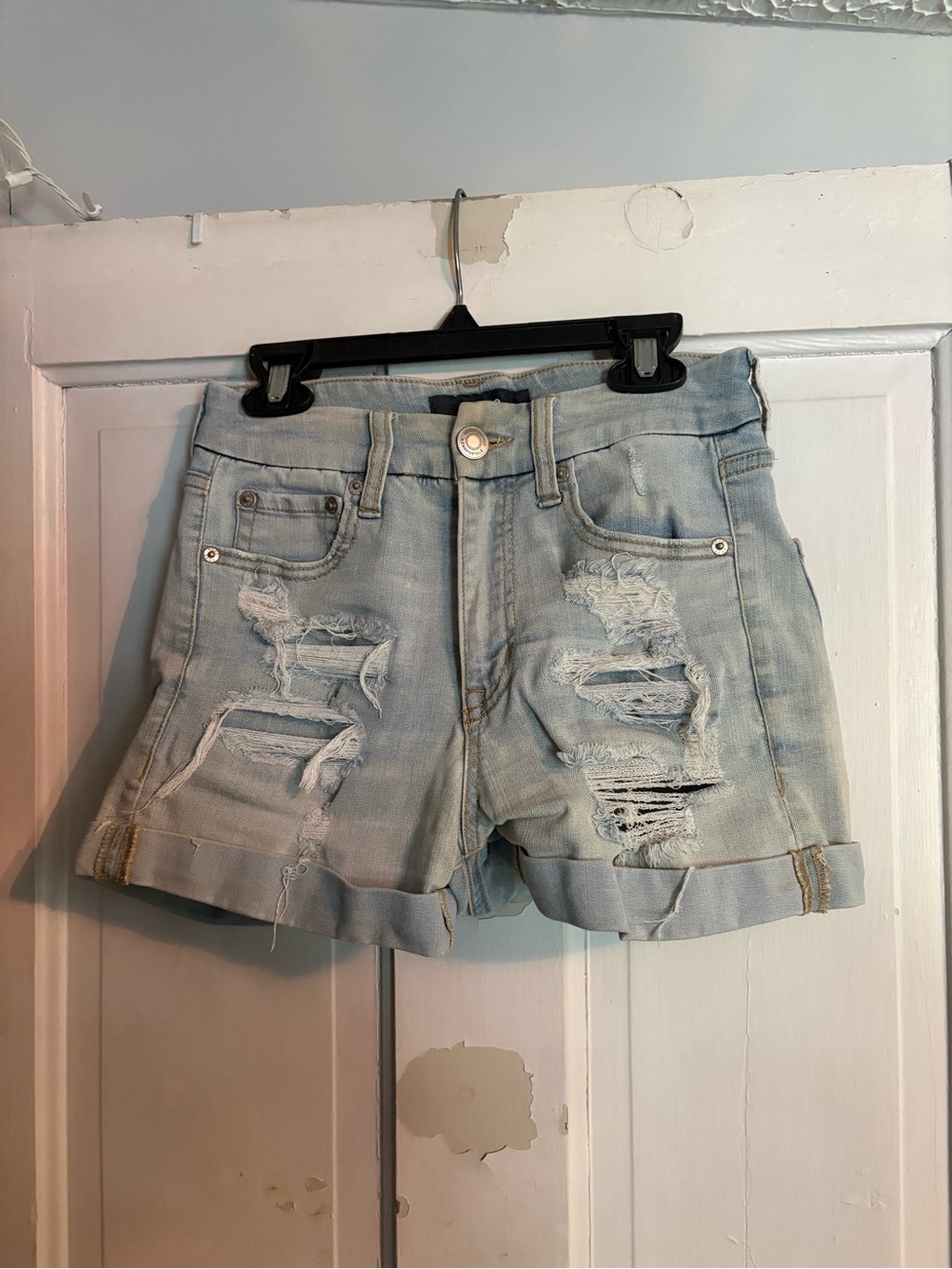 Women’s Light Blue Distressed Denim Roll-Cuff Shorts